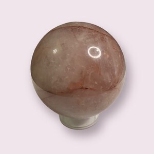 Fire Quartz crystal sphere with clear holder