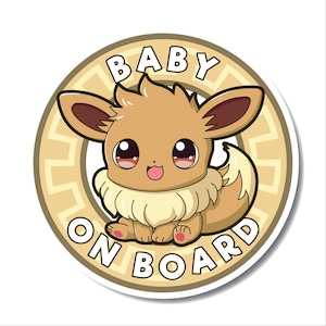 May include: A brown and tan cartoon baby Eevee with big eyes and a pink tongue sticking out. The Eevee is inside a circle with the words "BABY ON BOARD" in a brown font.