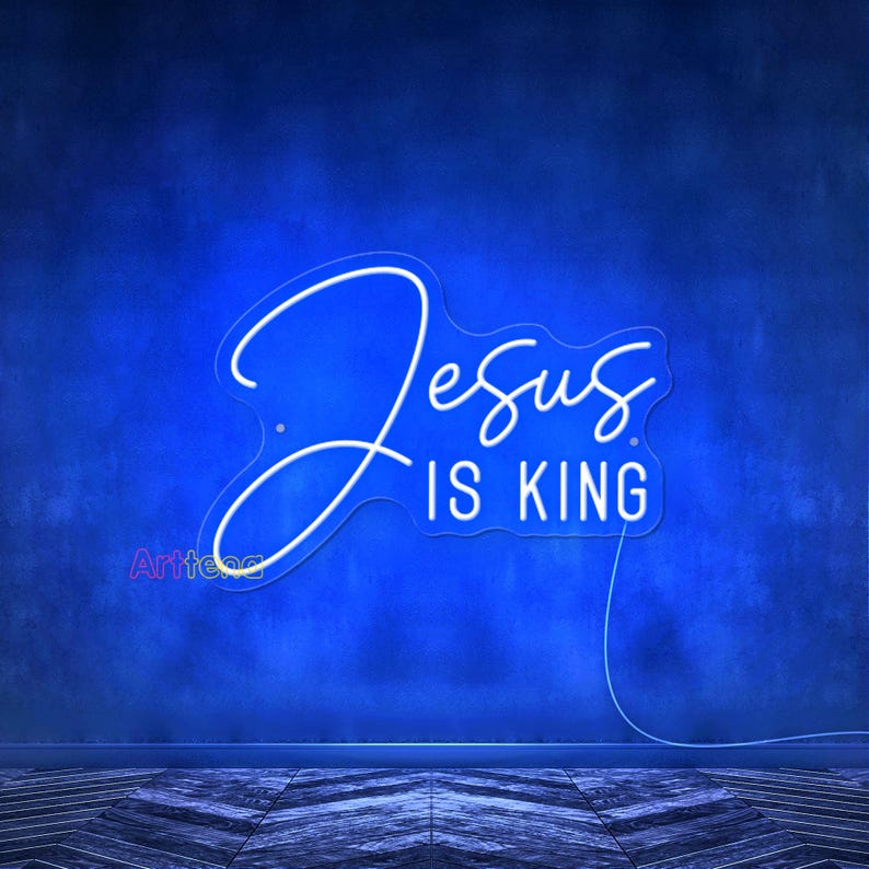 May include: White neon sign with the words "Jesus is King" on a blue wall.