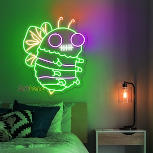 May include: A neon sign shaped like a bee with a skull and crossbones design. The bee is green and purple with a white outline. The sign is lit up and hanging on a wall.