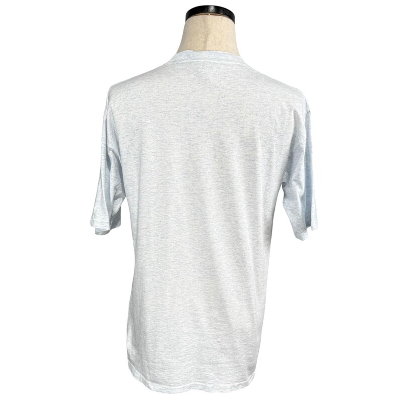 May include: A light gray short-sleeve t-shirt. The shirt is displayed on a mannequin. The fabric has a heathered appearance. The sleeves are short and the neckline is crew-cut. The shirt is a basic, casual style.