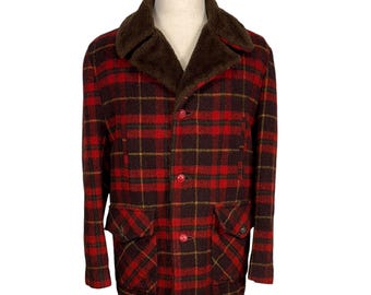 May include: A vintage plaid jacket in red, brown, and yellow. The jacket features a brown faux fur collar, red buttons, and two front pockets. The jacket is displayed on a mannequin.