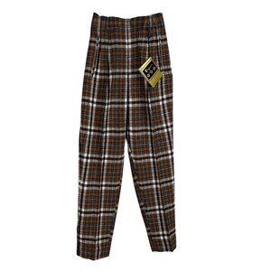 May include: High-waisted brown, black, and white plaid trousers. The trousers have a pleated front and a straight leg. A tag is attached. The trousers are made of a woven fabric.