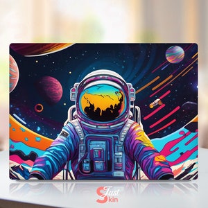 May include: A colorful astronaut illustration with a galaxy background. The astronaut is wearing a blue, purple, and yellow spacesuit with a yellow helmet. The background is a dark blue with stars, planets, and streaks of color.