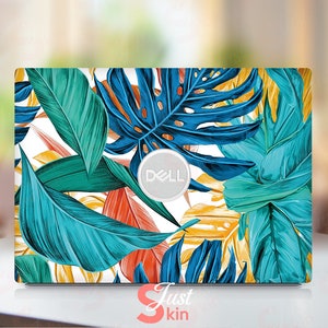 May include: A laptop skin with a tropical leaf design featuring blue, green, yellow, and orange leaves. The skin has a white background and a silver Dell logo in the center.