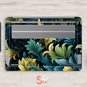May include: Laptop skin with a dark background and a floral pattern in shades of green, blue, and yellow. The design features intricate leaves and swirls.