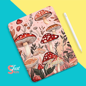 May include: Pink iPad case featuring a mushroom and leaf design. The case has the name "Amelia" written in gold lettering.