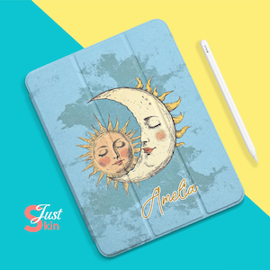 May include: A blue tablet case featuring a sun and moon design. The sun and moon are drawn in a vintage style and are kissing. The case has the name "Amelia" written on it in gold lettering.