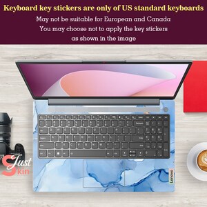 May include: A blue and white laptop skin with a marble pattern. The skin is designed to fit a US standard keyboard. The text "Lenovo" is visible on the bottom right corner of the skin.