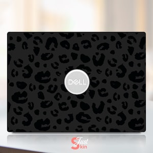 May include: Black laptop skin with a leopard print design. The Dell logo is visible in the centre of the laptop.