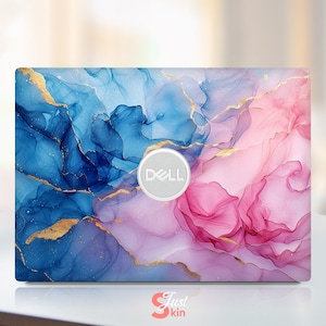 May include: A laptop skin with an abstract design featuring blue, pink, and gold swirls. The skin has the Dell logo in the center.