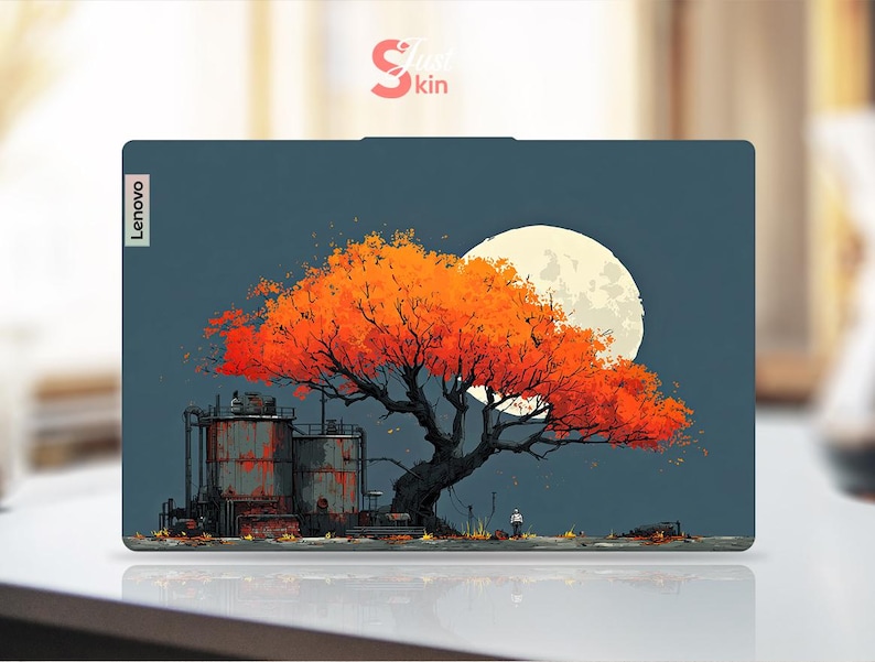 May include: A Lenovo laptop skin featuring an artistic illustration of a large tree with vibrant orange leaves, set against a full moon and a dark blue sky. Industrial structures are in the foreground.