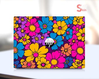 May include: A laptop skin with a colorful floral pattern. The design features a variety of flowers in shades of pink, yellow, blue, and purple. The HP logo is visible in the center of the skin.