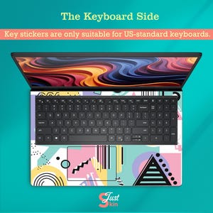 May include: Laptop with a keyboard skin featuring a colorful geometric design in pink, yellow, blue, and black. The text "The Keyboard Side" is at the top, with "Key stickers are only suitable for US-standard keyboards" below.