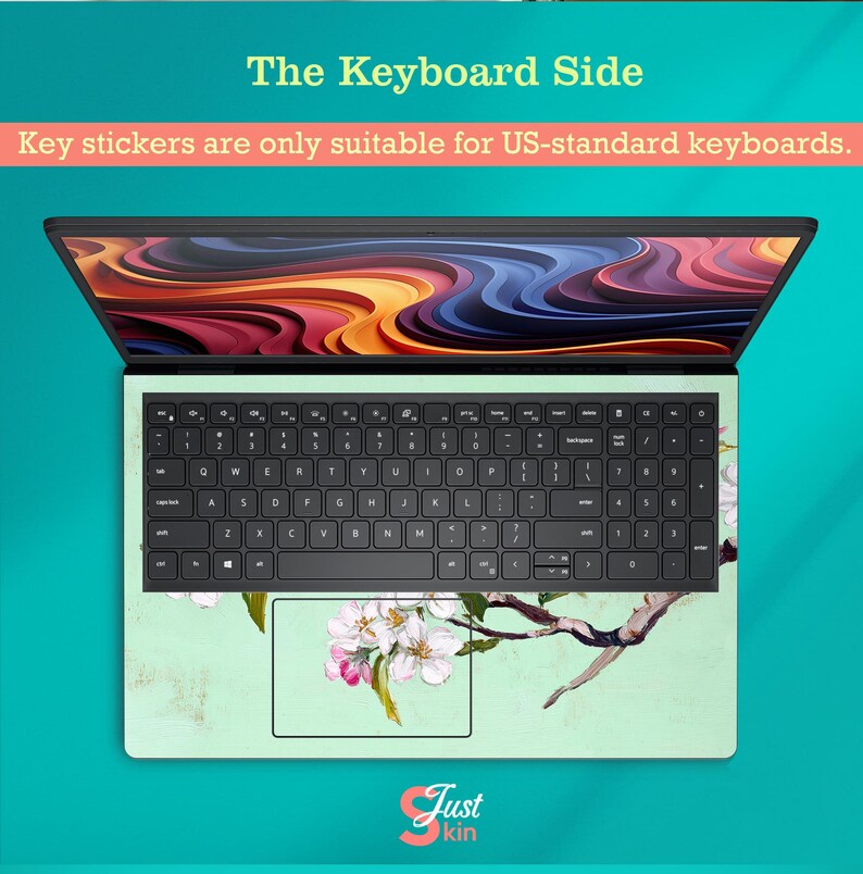 May include: Laptop keyboard skin with a floral design. The skin has a light green background with a branch of white and pink flowers. The keyboard has black keys. Text on the image reads: "The Keyboard Side" and "Key stickers are only suitable for US-standard keyboards."