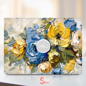 May include: A laptop skin with a floral design featuring blue and yellow flowers painted in a textured style. The Dell logo is visible on the skin.