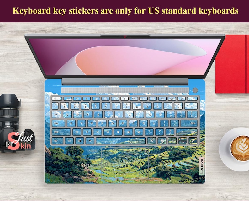 May include: Laptop keyboard skin with a landscape design featuring green terraced fields, blue sky, and white clouds. The keyboard keys are light blue. The text on the top says: "Keyboard key stickers are only for US standard keyboards."