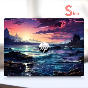 May include: A laptop skin with a colorful sunset over a body of water with rocky islands. The skin has the HP logo in the center.