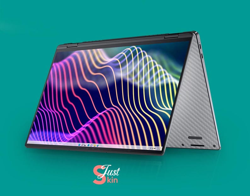May include: A silver laptop computer with a black screen displaying a colorful abstract design. The laptop is open and the lid is folded back, revealing the keyboard and trackpad. The laptop is sitting on a teal surface.