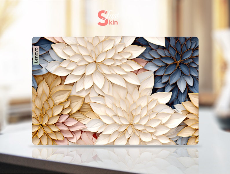May include: A laptop skin with a floral design featuring white, gold, and blue flowers. The skin has the word "Lenovo" printed on the left side.