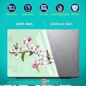 May include: Laptop skin with a floral design of white and pink blossoms on a pale green background. The skin is shown applied and partially peeled back, revealing the laptop's surface. Text includes "Decorate", "Anti-stain", and "Just kin".