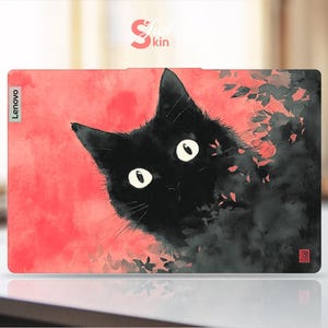 May include: Lenovo laptop skin featuring a black cat with large white eyes against a red and black watercolor background. The cat's fur blends with the dark background, and the Lenovo logo is visible.