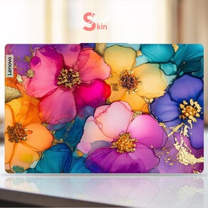 May include: A Lenovo laptop skin featuring a vibrant floral design. The artwork showcases large, abstract flowers in shades of pink, orange, yellow, blue, and purple, with gold accents. The "Skin Kin" logo is visible in the top right corner.