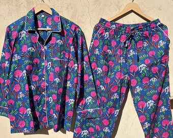 May include: A blue and pink floral print pajama set with a long-sleeved shirt and matching pants.