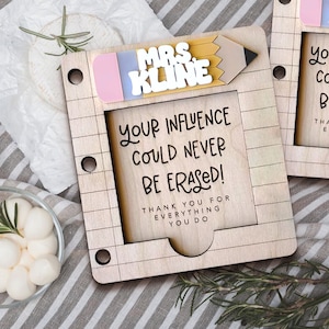 May include: A wooden teacher appreciation gift with a pencil eraser and the text "MRS. KLINE YOUR INFLUENCE COULD NEVER BE ERASED! THANK YOU FOR EVERYTHING YOU DO".