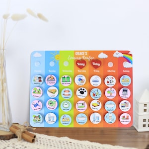 May include: A colorful wooden chore chart with the text "GRACE'S Evening Roufne" and daily activity icons. The chart includes sections for each day of the week, with illustrations for tasks like "Eat Dinner," "Take out Trash," and "Homework."