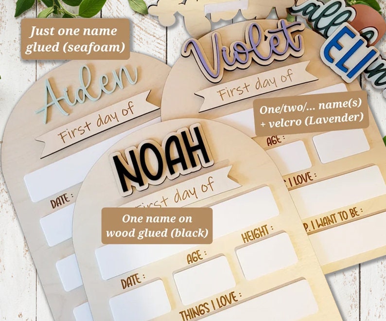 May include: Three wooden plaques with rounded tops, each with a different name written in decorative lettering. The names are Aiden, Noah, and Violet. Each plaque has a section for recording the child's first day, age, height, things they love, and what they want to be. The plaques are made of natural wood and have a rustic, handmade look.