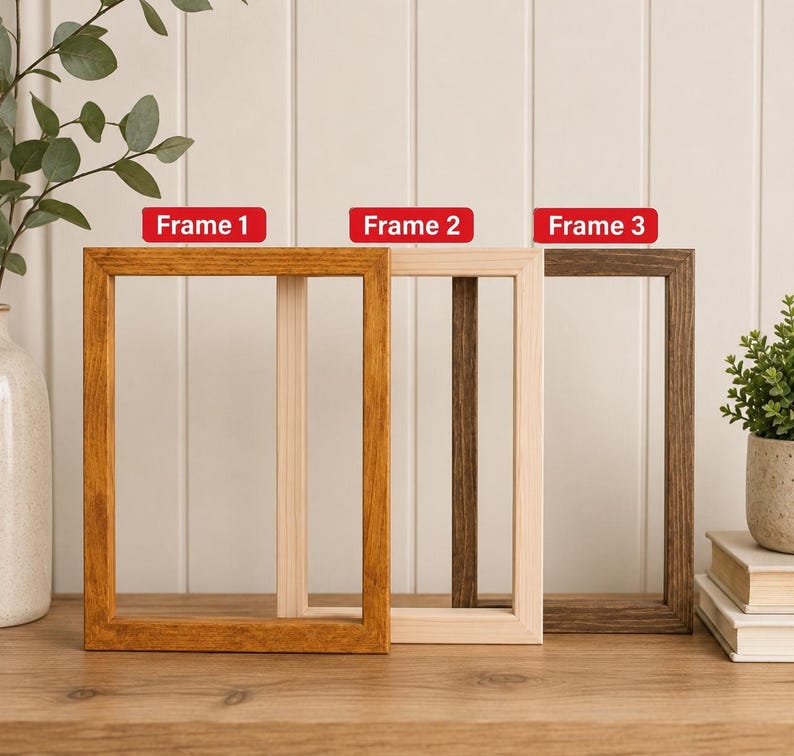 May include: Three rectangular wooden picture frames arranged in a row. Frame 1 is a medium-toned brown, Frame 2 is a light natural wood, and Frame 3 is a dark espresso brown. Each frame features a simple, clean-lined design with visible wood grain.