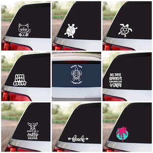 May include: Nine different car window decals with various designs and text. The decals feature a cat, a turtle, a palm tree, a cow, and text such as "Live Love Adopt", "Save the Turtles", "All these flavors & you want to be salty", "Don't be a salty heifer", and "Beach".