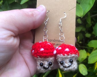 mushroom dangly earrings with smiley faces