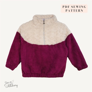 May include: A two-tone fleece jacket with a high collar and a quarter-zip closure. The top portion is cream-colored, while the lower section and sleeves are a deep magenta. The jacket has a star-shaped zipper pull and the text "PDF Sewing Pattern".