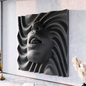 May include: A large, square, black wall sculpture featuring a three-dimensional, layered, parametric design that forms the shape of a human face with lips slightly parted. The surface is composed of numerous vertical, parallel, curved slats.