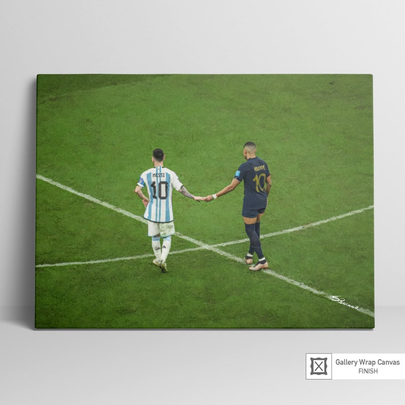 May include: Two soccer players, one in a blue and white jersey with the number 10 and the name "MESSI" on the back, and the other in a dark blue jersey with the number 10 and the name "MBAPPE" on the back, shake hands on a green soccer field.