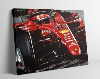 May include: A red Formula 1 race car with a driver in the cockpit. The car is on a track and the front tire is in focus. The car has sponsors logos including Richard Mille, Shell, and Santander.