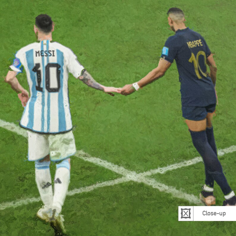 May include: Two soccer players, one in a light blue and white striped jersey with the number 10 and the name "MESSI" on the back, and the other in a dark blue jersey with the number 10 and the name "MBAPPE" on the back, shake hands on a green field.