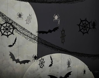 May include: Halloween decorations featuring black bats, spiderwebs, and spiders hanging against a backdrop of large, illuminated moons. A dark, textured net hangs across the top, adding to the spooky ambiance. The scene is set against a dark gray background.