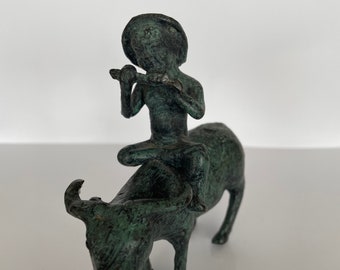 Bronze figure of a peasant playing the flute and riding a water buffalo with a greenish patina | bronze sculpture | Vintage Home Decor |