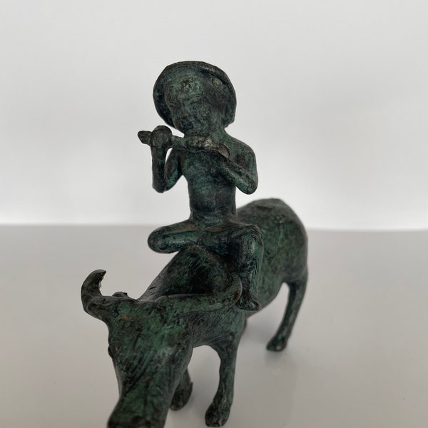 Bronze figure of a peasant playing the flute and riding a water buffalo with a greenish patina | bronze sculpture | Vintage Home Decor |