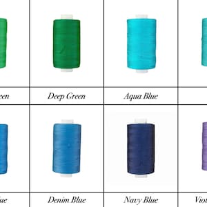 May include: Eight spools of thread in various shades of green, blue, and purple. The spools are arranged in two rows of four. The colors are labeled: Mid Green, Deep Green, Aqua Blue, Teal, Mid Blue, Denim Blue, Navy Blue, and Violet Purple.