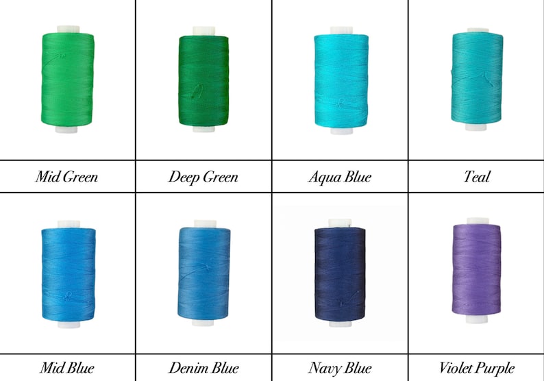May include: Eight spools of thread in various shades of green, blue, and purple. The spools are arranged in two rows of four. The colors are labeled: Mid Green, Deep Green, Aqua Blue, Teal, Mid Blue, Denim Blue, Navy Blue, and Violet Purple.