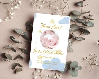 May include: A white card with blue clouds and gold stars. The card reads "Forever Loved" and "Jordan Mark Thomas" with the dates "1 April 2022 - 5 April 2022". The card also includes the text "We loved you every second of your life and will miss you for the rest of ours."