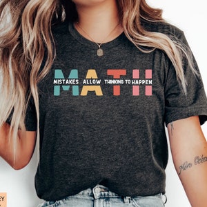 May include: Dark grey heather t-shirt with the text "MATH" in colorful letters. The text "Mistakes allow thinking to happen" is written below the word "MATH".