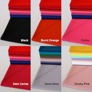 May include: A set of 10 fabric swatches in various colors, including black, burnt orange, cerise, dark cerise, dove grey, and dusky pink.
