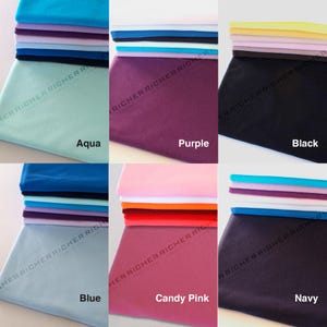 May include: A collection of ten fabric swatches in various colors, including aqua, purple, black, blue, candy pink, and navy. Each swatch is folded in a stack of five layers.