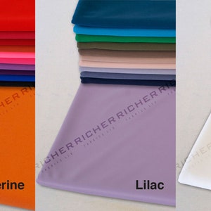 May include: A stack of fabric swatches in various colors, including red, orange, pink, purple, blue, green, yellow, and white. The swatches are labeled with the colors: Tangerine, Lilac, and White.