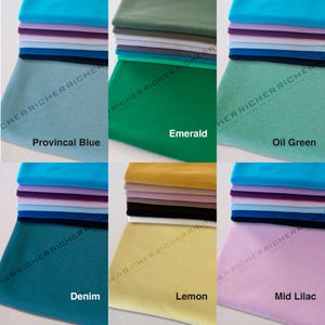May include: Stacks of fabric swatches in various colors, including provincial blue, emerald, oil green, denim, lemon, and mid lilac. The fabric swatches are arranged in a grid pattern.